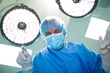 © WavebreakMediaMicro - Surgeon holding surgical tool in operation room
