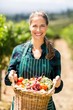 © WavebreakmediaMicro - Portrait of happy female farmer holding a basket of vegetables