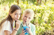 © Brocreative - Cute kids sharing a delicious flavored ice drink together