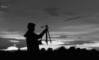 Photographer silhouette with black and white theme