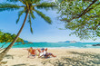 © Netfalls - Couple on the beach at tropical resort Travel magazine
