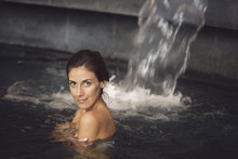 Woman Soaking In Spa Pool