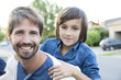 © PhotoAlto - Father and son together outdoors, portrait