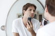 © PhotoAlto - Man shaving with electric razor