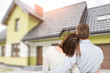 © REDPIXEL - Young couple looking at dream house.