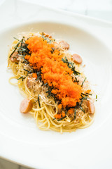 Wall Mural - Spaghetti with sausage , shrimp egg , seaweed , dry squid on top