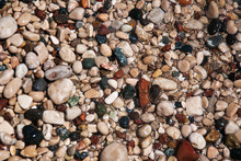 Stones On Beach And Sea Water