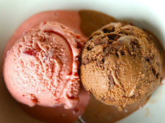 two ice cream balls chocolate strawberry