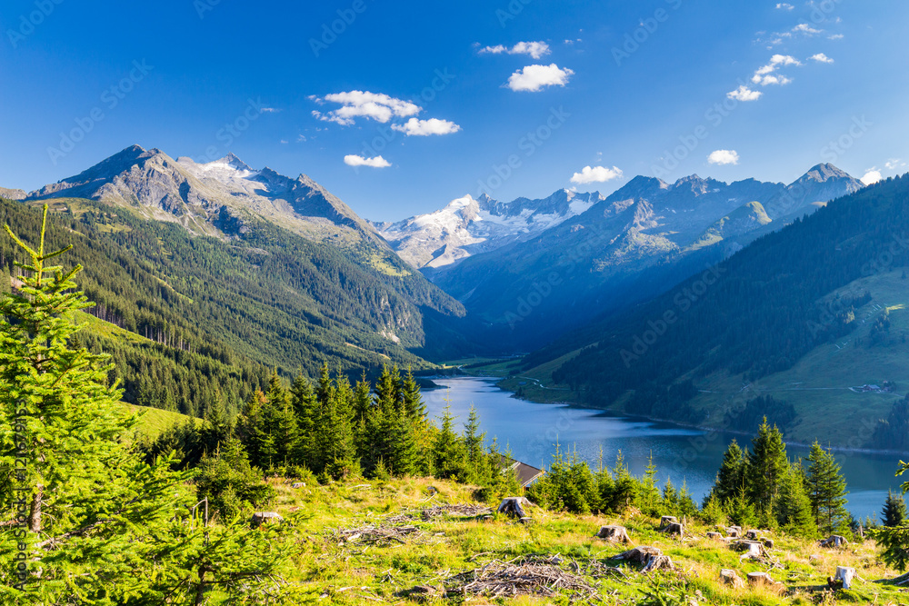 Summer sunny scene in the valley of Speicher Durlassboden lake in the Austrian Alps. View from Gerlos pass, Austria, Europe. - obrazy, fototapety, plakaty 