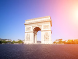 Fototapeta Paryż - Arc de triomphe in Paris during a sunny day, France