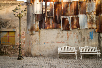 Wall Mural - White chair with evening sun.