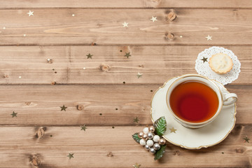 Cup Of Tea. Mince Pie. Shining Stars. Wooden Background With Cop