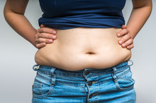 Overweight Woman In Jeans And Fat On Hips And Belly