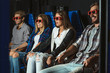 © Yakobchuk Olena - friends sitting in 3D glasses