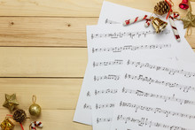 Create Music Sheet Note Paper By Myself.Top View Pencil,music Sheet With Christmas Decoration.
