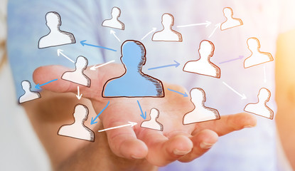 Businessman holding hand drawn social network