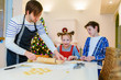 © TravelPhotoBloggers - Family baking on Christmas eve