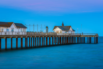 Southwold Pier, a popular English seaside destination in Suffolk, at sunset