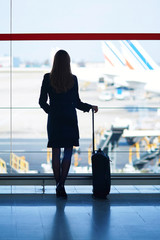 Young female traveler in international airport