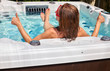 © grinny - Beautiful woman relaxing in hot tub.