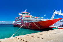 Red Ferry Boat Docked At Limenas On Thassos Island, Greece - Clear Skies, Perfect Weather, Crystal Water - Ideal Vacation Spot