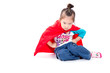 © phaitoon - Superhero little asian girl in a red raincoat on white backgroun