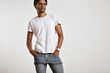 © BublikHaus - Portrait of a sensual black young model in unlabeled white t-shirt, light blue jeans and wearing a vintage digital watch