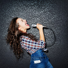 Woman Singing With Microphone