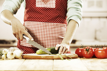 woman with knife and kitchen room 