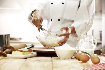 cook in kitchen interior 