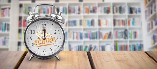 Poster - Composite image of alarm clock over white background 