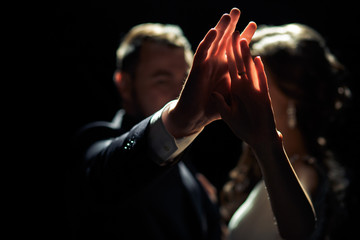 Touch with the hands of the bride and a groom