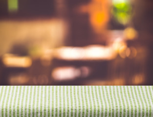 Aufkleber - Empty grenn tablecloth on table and blurred restaurant bokeh lig