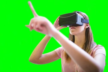 Poster - Composite image of woman using a virtual reality device