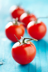 Cherry tomatoes on a blue wooden table