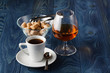 © Andrey Cherkasov - Close up a glass of cognac and coffee