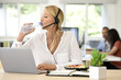 © goodluz - Busy customer service manager eating lunch in office