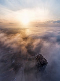 Aerial view from sky with fog and clouds at morning time. Skycraper and clouds, Unity Tower