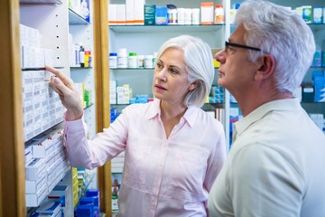 Wall Mural - Customers checking medicines