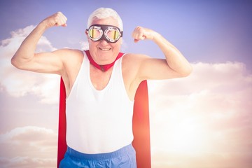 Poster - composite image of senior man pretending to be a superhero