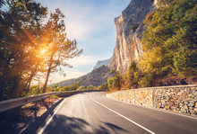 Asphalt Road. Colorful Landscape With Beautiful Mountain Road With A Perfect Asphalt. High Rocks, Trees, Blue Sky At Sunrise In Summer. Vintage Toning. Travel Background. Highway At Mountains