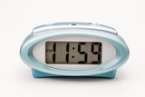 Fototapeta Perspektywa 3d - Electric clock dispaying 11:59 pm, one minute until midnight.