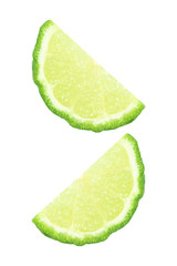 Wall Mural - two pieces of green lime isolated on white