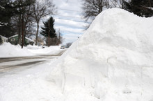 Snow Pile By The Side Of Street After Snow Storm