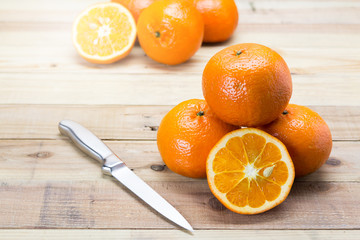 Wall Mural - Fresh oranges on wooden background.