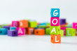 Goal word spelled with wooden block