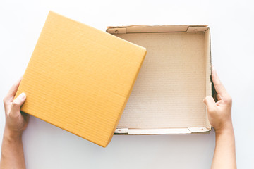 Hands hold and open the empty(blank) box on  white background