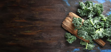 Fresh Sliced Italian Kale Salad On Old Wooden Board. Dark Backgr