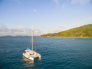 Wall Mural - Aerial view of catamaran sailling in coastline