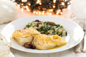 Canvas Print - cod fish with vegetables on white plate